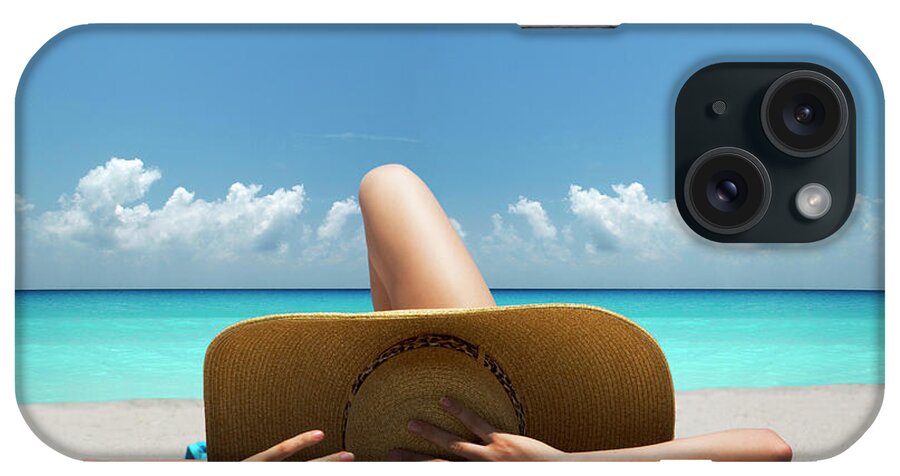 Tranquility iPhone Case featuring the photograph Woman Laying On Towel On Beach by Lost Horizon Images