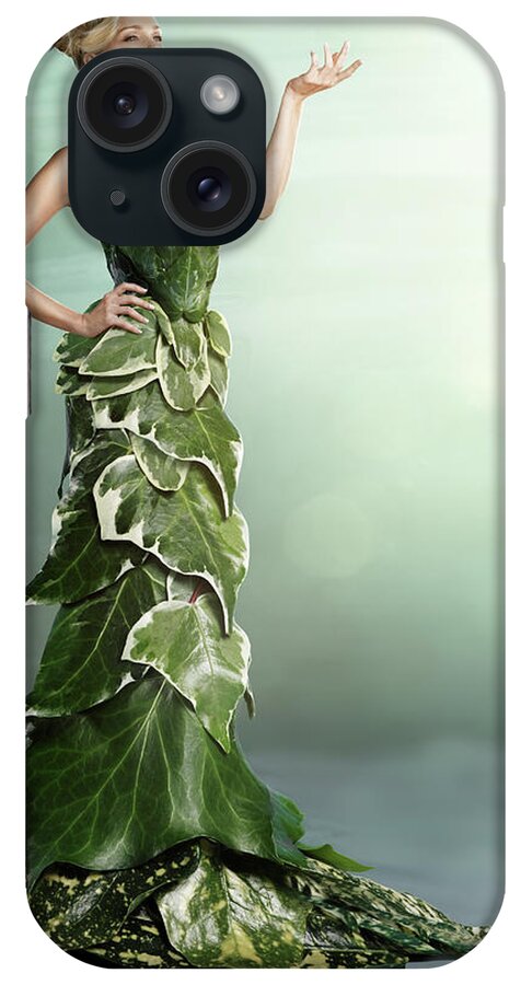 Environmental Conservation iPhone Case featuring the photograph Woman Wearing A Long Gown Made Of Leaves by Paper Boat Creative