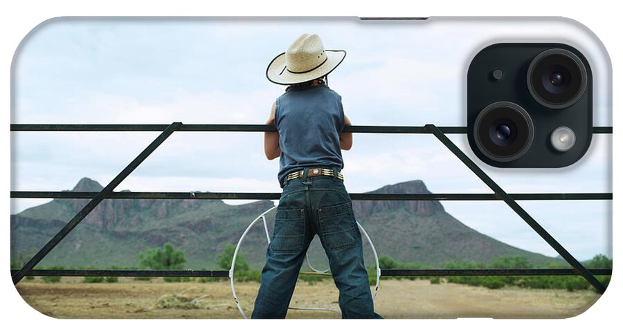Child iPhone Case featuring the photograph Young Boy 7-8 Standing On Ranch Railing by John Slater