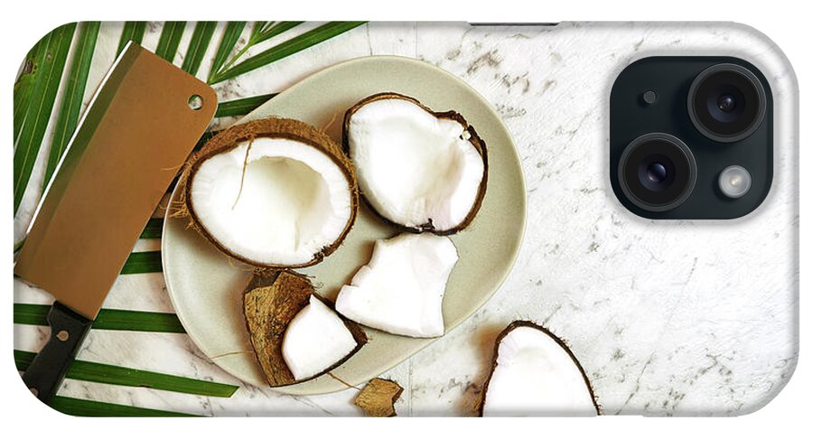 Coconut iPhone Case featuring the photograph Coconut cut into pieces on plate on marble table top, creative flat lay. #1 by Milleflore Images