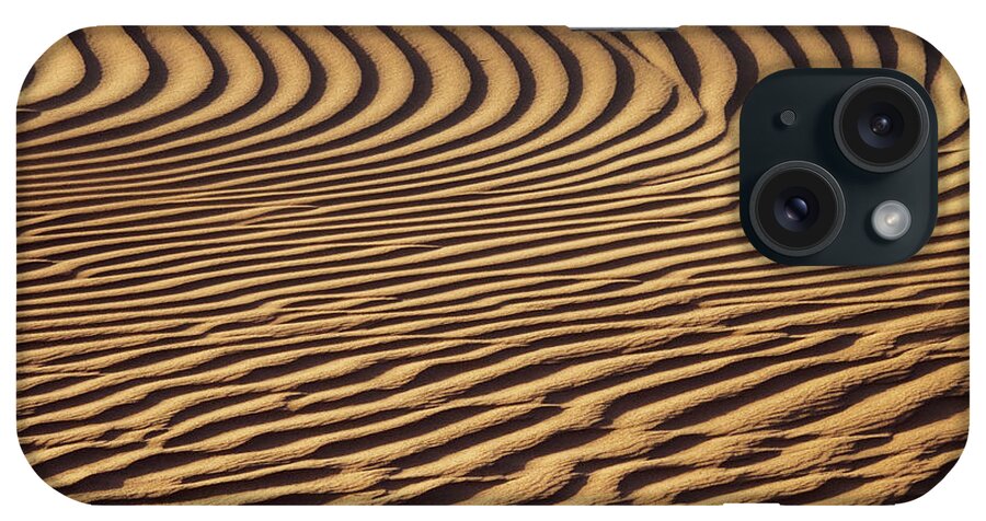 Sand iPhone Case featuring the photograph Beautiful sand dune pattern in wind by Mikhail Kokhanchikov