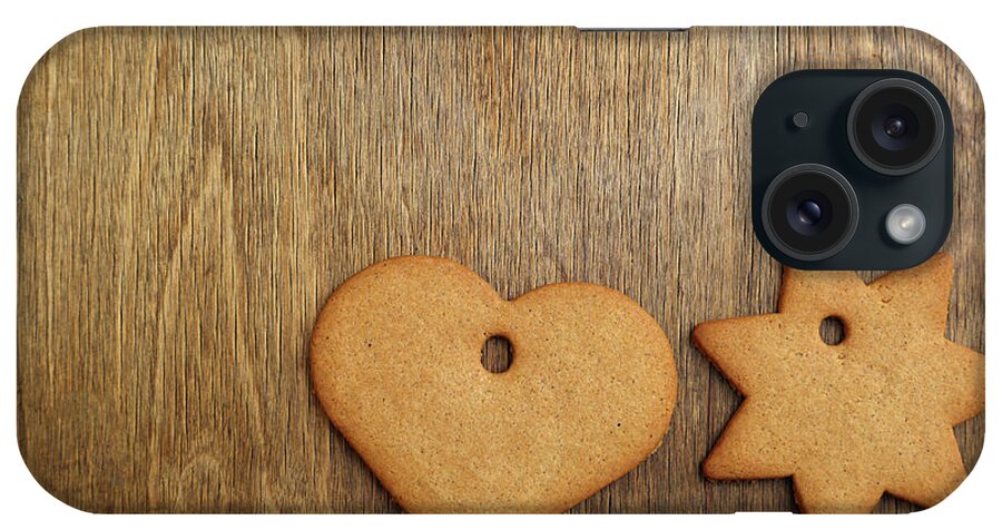 Christmas iPhone Case featuring the mixed media Christmas gingerbread cookie over wooden table by Mikhail Kokhanchikov