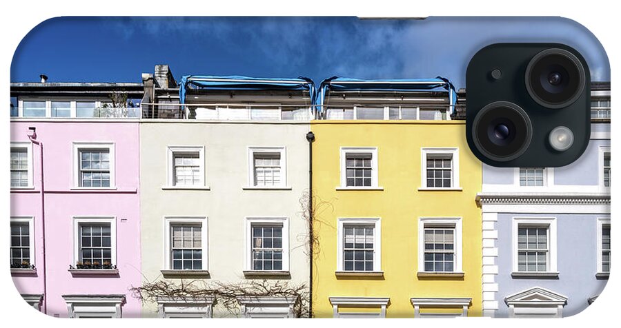 Houses iPhone Case featuring the photograph Colourful terraced townhouses with summer sky background. The ar by Jane Rix