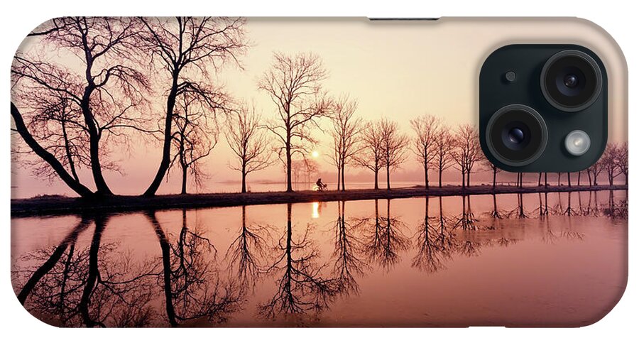 Sunrise iPhone Case featuring the photograph Endlessness - Silhouette reflected on an early morning sunrise by Roeselien Raimond