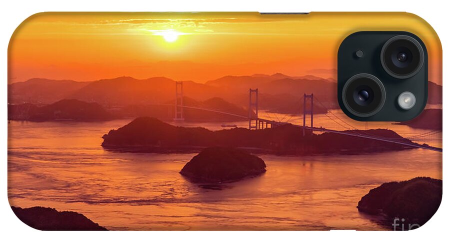 Sunset iPhone Case featuring the photograph Hazy sunset on Kurushima Kaikyo Bridge and Kurushima Strait by Lyl Dil Creations