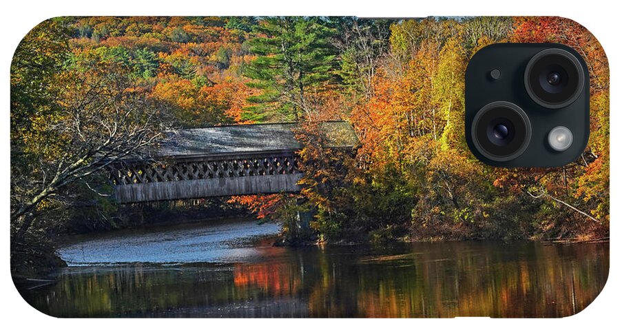 Henniker iPhone Case featuring the photograph Henniker Covered Bridge in Fall Foliage Contoocook River Henniker NH by Toby McGuire