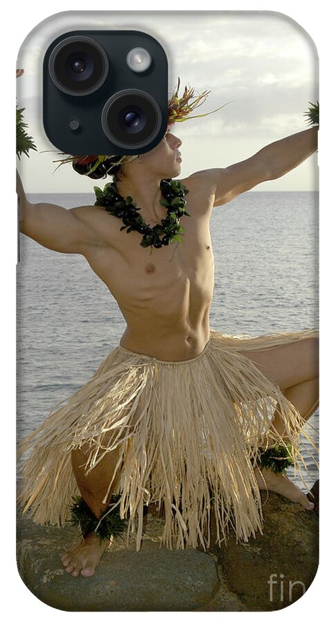 Beach iPhone Case featuring the photograph Male Hula Dancer poses on the beach in a traditional sun worship move. by Gunther Allen