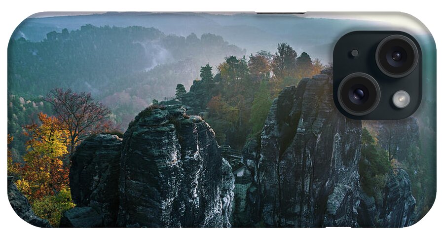 Saxon Switzerland iPhone Case featuring the photograph Morning mist on the Bastei rocks in Saxon Switzerland by Sun Travels