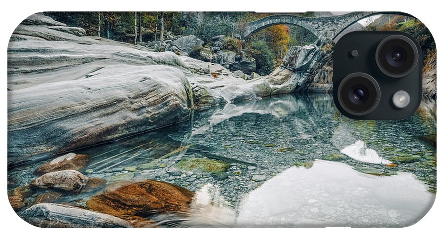 2018 iPhone Case featuring the photograph Old stone bridge over crystal clear water by Benoit Bruchez