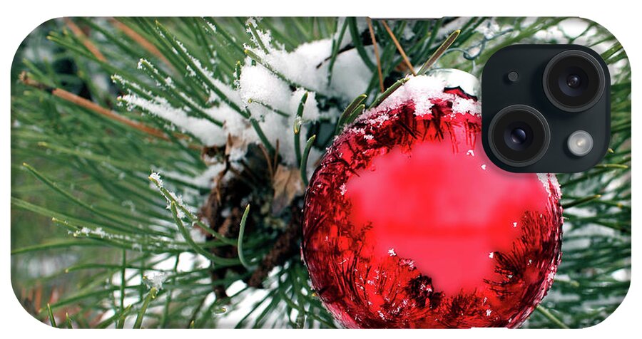 Red iPhone Case featuring the photograph Red Ornament in Evergreen with Snow by Pete Klinger