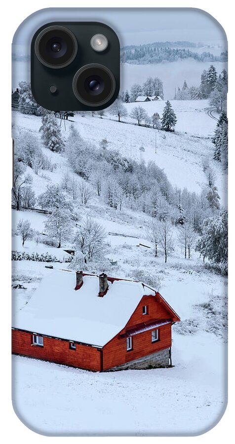 Landscape iPhone Case featuring the photograph Snowy landscape with little red House by Jaroslaw Blaminsky
