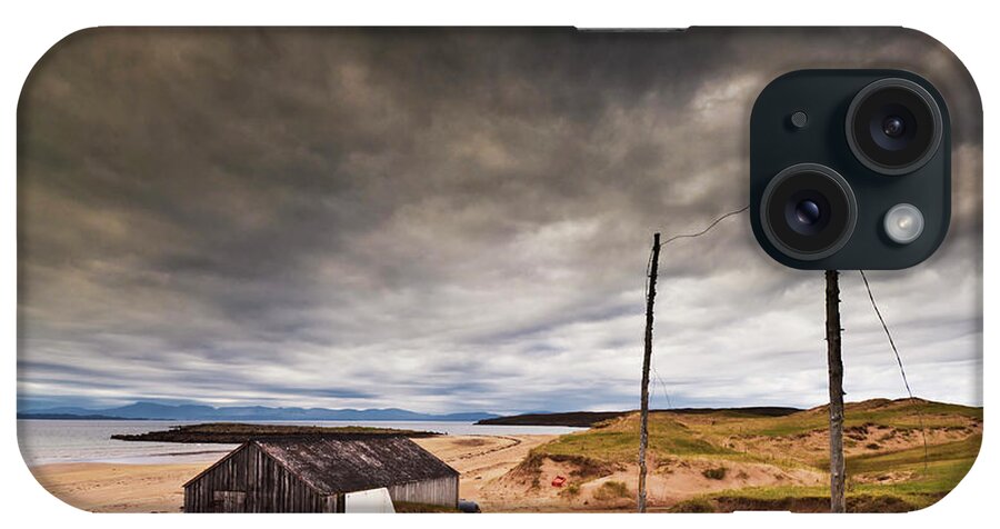 Scotland Beach iPhone Case featuring the photograph Stormy sky and abandoned fishing hut, Red point beach, Wester Ross, Scotland by Neale And Judith Clark