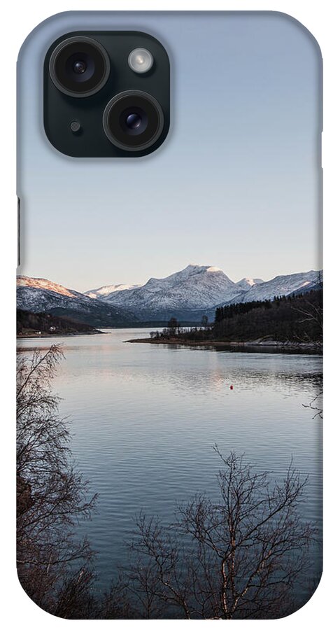 Christmas iPhone Case featuring the photograph The snowy hills are illuminated by the last vestige of orange sunlight. Narvik, Norway by Vaclav Sonnek