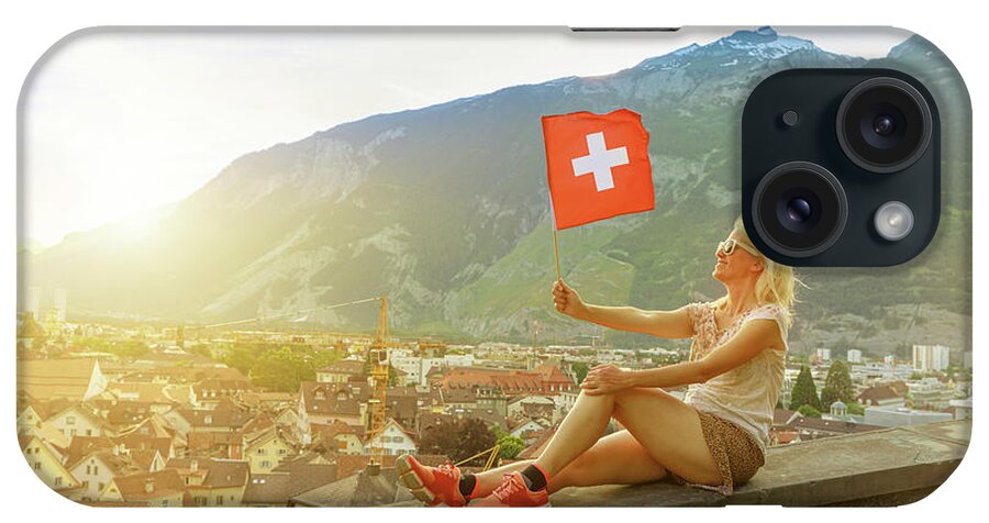 Switzerland iPhone Case featuring the photograph tourist woman by Chur sunset skyline by Benny Marty