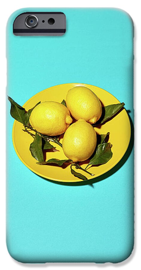 Color iPhone 6s Case featuring the photograph Yellow lemons on cyan by Oleg Cherneikin