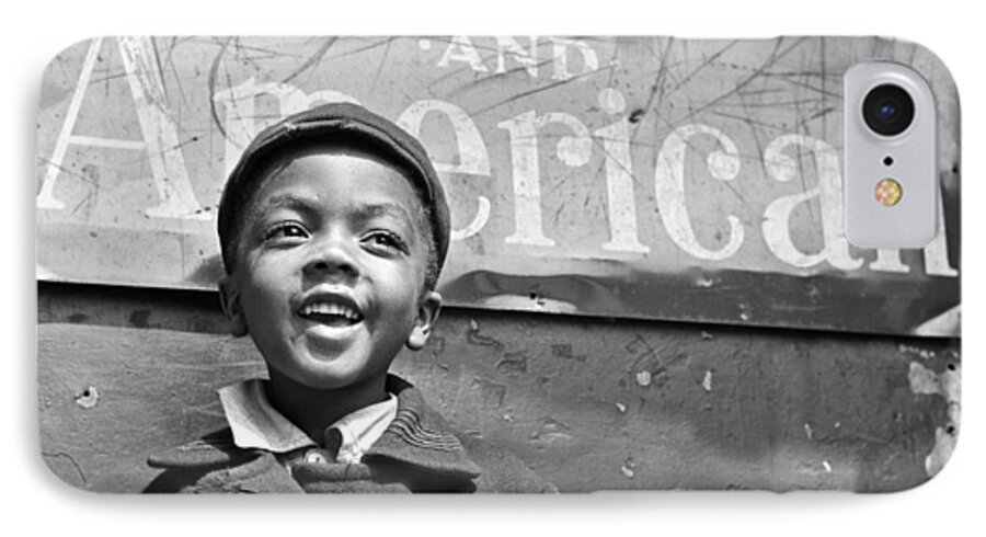 1943 iPhone 7 Case featuring the photograph A Young Harlem Newsboy by Underwood Archives