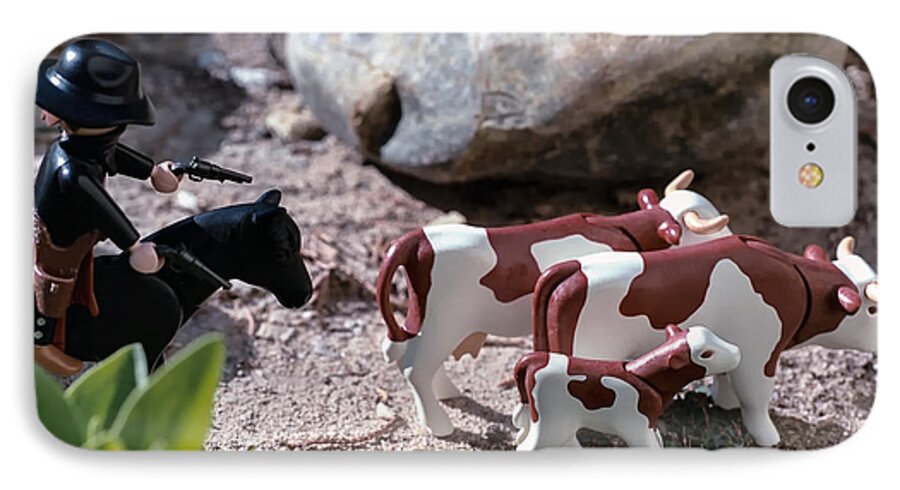 Toys iPhone 7 Case featuring the photograph Cattle Rustler by Caitlyn Grasso