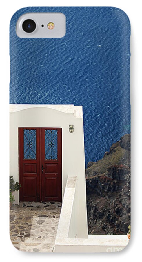 Santorini iPhone 7 Case featuring the photograph Door facing the Aegean sea by Aiolos Greek Collections