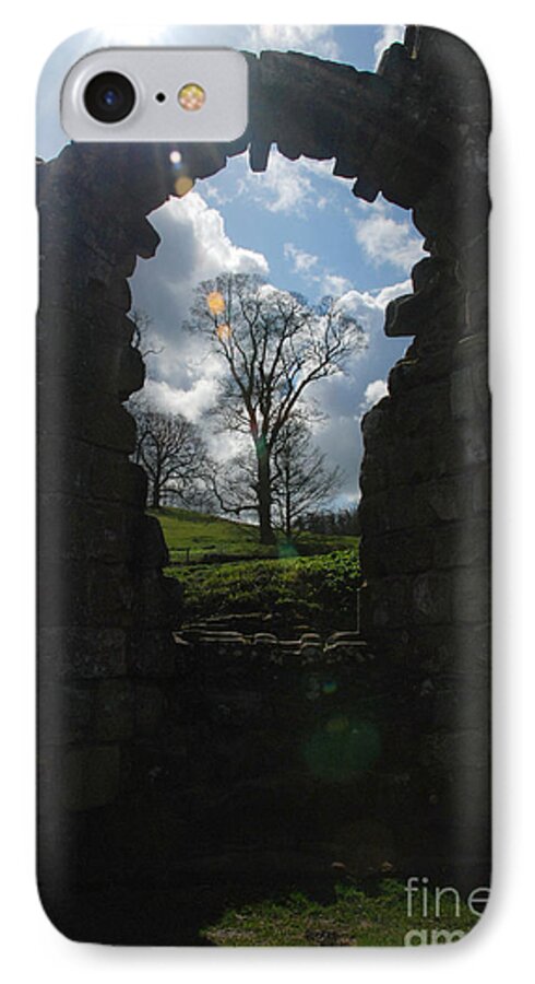 Fountains Abbey Yorkshire Uk Stone Wall Window Sun Ray Tree Arch iPhone 7 Case featuring the photograph Fountains Abbey by Richard Gibb