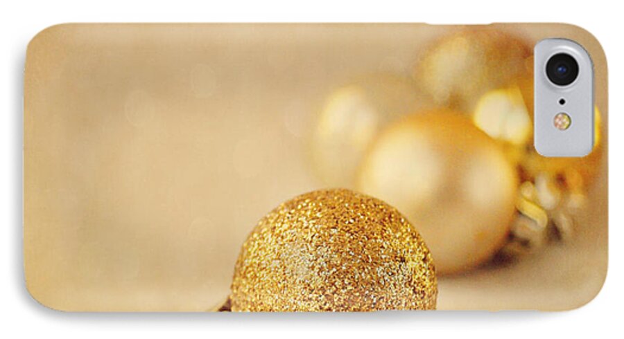 Baubles iPhone 7 Case featuring the photograph Gold glittery Christmas baubles by Lyn Randle