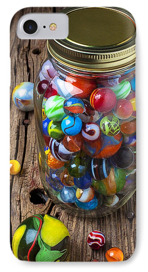 Jar iPhone 7 Case featuring the photograph Jar of marbles with shooter by Garry Gay