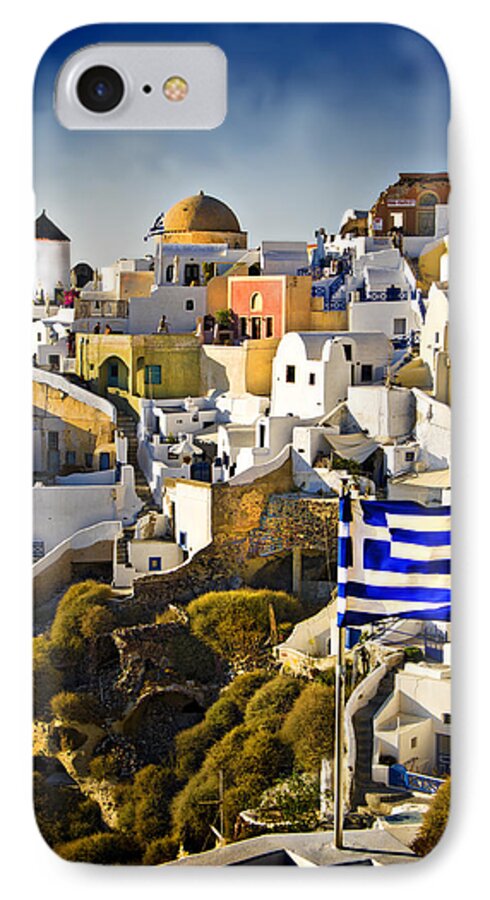 Santorini iPhone 7 Case featuring the photograph Oia and a greek flag by Meirion Matthias