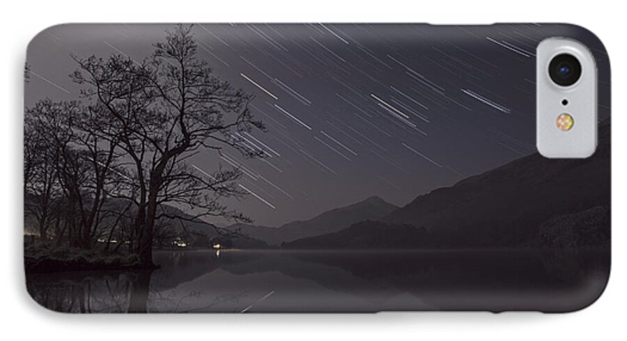 Star Trails iPhone 7 Case featuring the photograph Star trails over lake by B Cash