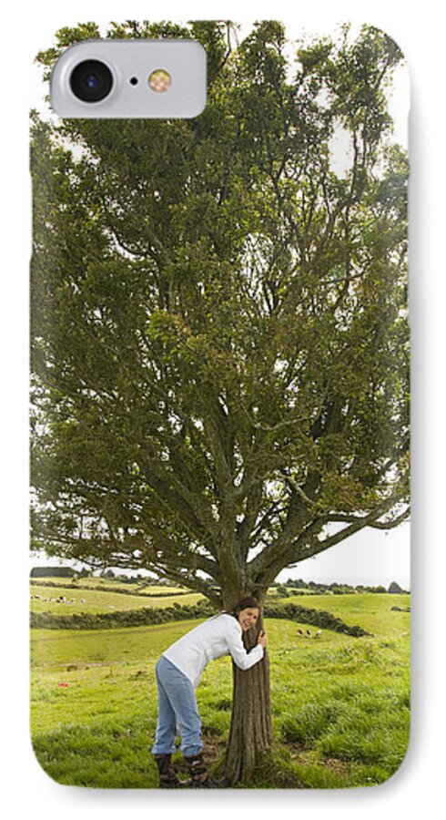 Green iPhone 7 Case featuring the photograph Hugging the fairy tree in Ireland by Ian Middleton