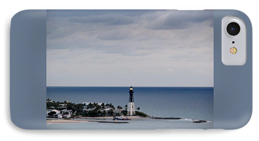 Lighthouse iPhone 7 Case featuring the photograph Lighthouse and Rain Clouds by Corinne Carroll