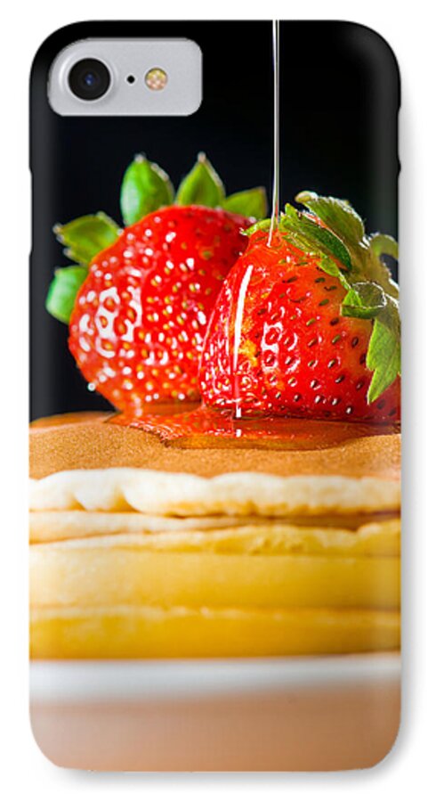 Berries iPhone 7 Case featuring the photograph Strawberry butter pancake with honey maple sirup flowing down by U Schade