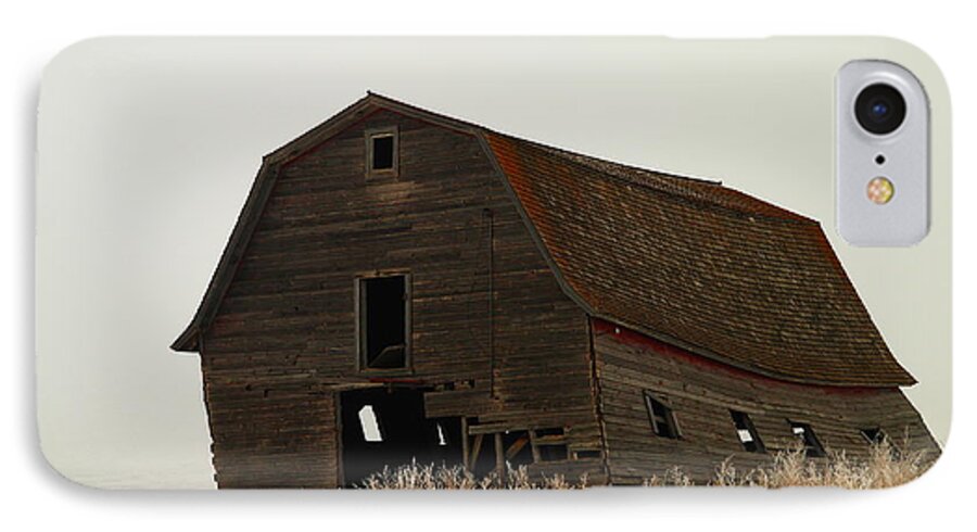 Barns iPhone 8 Case featuring the photograph An Old Leaning Barn In North Dakota by Jeff Swan
