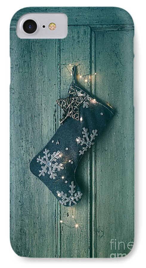 Celebration iPhone 8 Case featuring the photograph Holiday stocking with lights hanging on old door by Sandra Cunningham