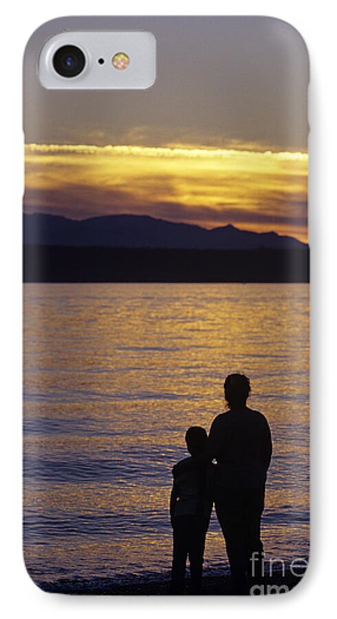 Travel iPhone 8 Case featuring the photograph Mother and daughter holding each other along Edmonds Beach at su by Jim Corwin