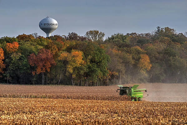Corn Harvest John Deere Combine Water Tower Stoughton Wisconsin Wi Landscape Farming Rural Agriculture Autumn Fall Trees Yellow Gold Horizontal Poster featuring the photograph Stoughton WI Corn Harvest by Peter Herman