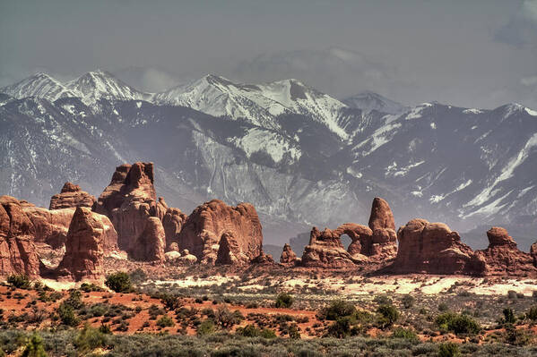 Arches Poster featuring the photograph Sandstone formations and Turret Arch vista in Arches National Park with La Sal mountains behind by Peter Herman