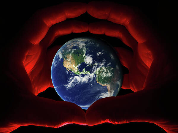 Earth Poster featuring the photograph In Our Hands - Earth viewed from space grasped within globed hands by Peter Herman