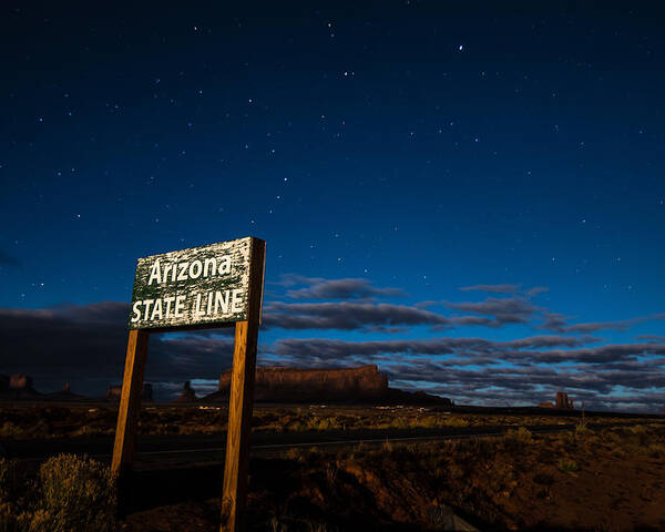 Arizona Poster featuring the photograph Arizona State Line in Monument Valley at Night by Todd Aaron