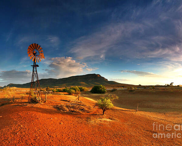 First Light Early Morning Windmill Dam Rawnsley Bluff Wilpena Pound Flinders Ranges South Australia Australian Landscape Landscapes Outback Red Earth Blue Sky Dry Arid Harsh Poster featuring the photograph First Light on Wilpena Pound by Bill Robinson