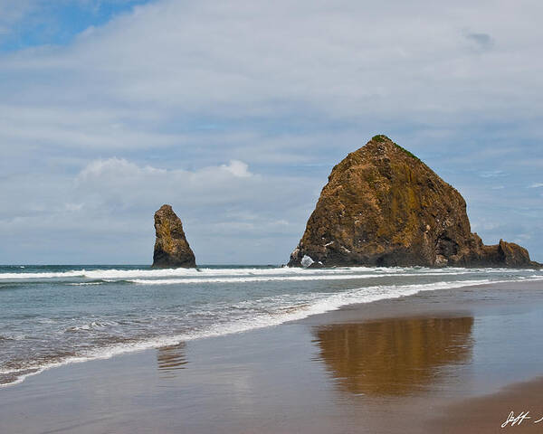 Beach Poster featuring the photograph Haystack Rock Reflected in the Wet Sand by Jeff Goulden