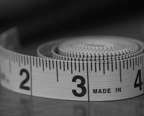 Tape Measure Poster featuring the photograph Measuring Up by Holden The Moment