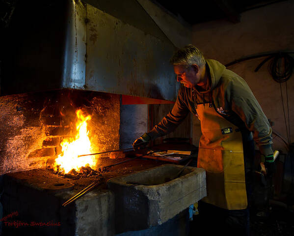 The Torresta Blacksmith Poster featuring the photograph The Torresta Blacksmith by Torbjorn Swenelius