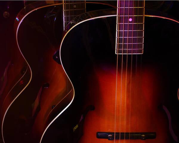 Guitars Poster featuring the photograph Row of guitars by Jim Mathis