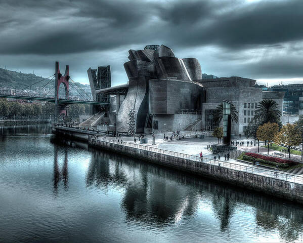 Spain Bilbao Guggenheim Museum Basque Country Frank Gehry Contemporary Architecture Nervion River City Daring And Innovative Curves Building Exterior Spectacular Building Deconstructivism Ferrovial Clad In Glass Poster featuring the photograph The Guggenheim Museum Bilbao Surreal by Andy Myatt