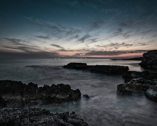 Seascape Poster featuring the photograph Beautiful dramatic Sunset on a rocky coastline by Michalakis Ppalis