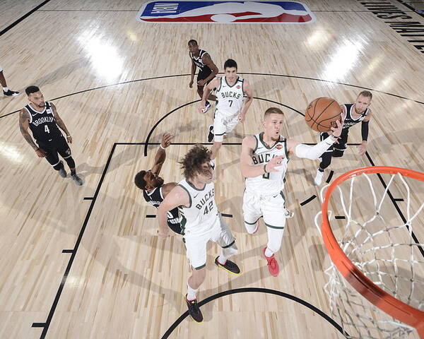 Nba Pro Basketball Poster featuring the photograph Brooklyn Nets v Milwaukee Bucks by David Dow