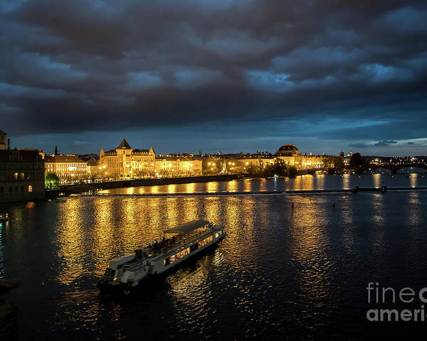 Architecture Poster featuring the photograph Illuminated Moldova River With Ship And Buildings In The Night In Prague In The Czech Republic by Andreas Berthold