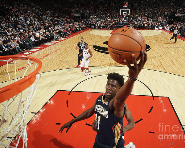 Jrue Holiday Poster featuring the photograph Jrue Holiday by Ron Turenne