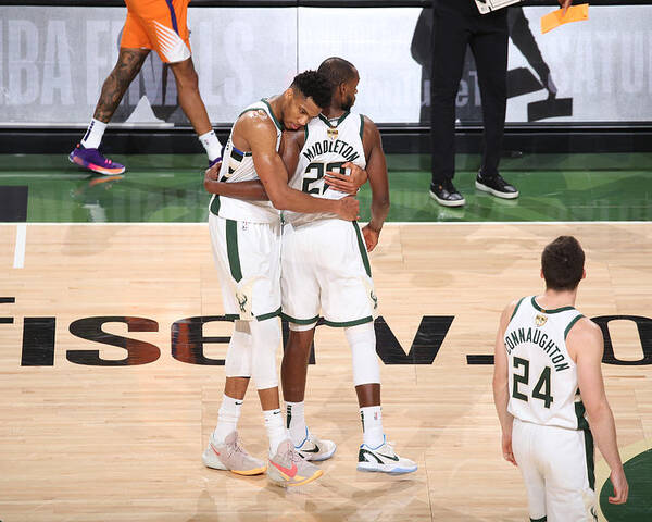 Giannis Antetokounmpo Poster featuring the photograph Khris Middleton and Giannis Antetokounmpo by Gary Dineen