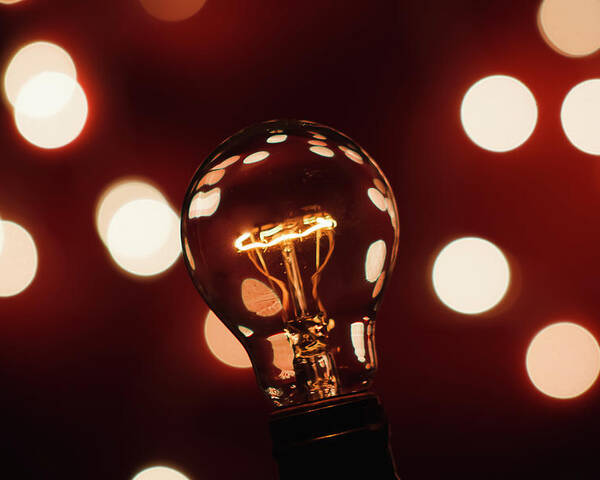 Light Bulb Poster featuring the photograph Light Bulb Bokeh by Gary Geddes