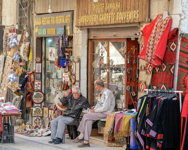 Jordan Poster featuring the photograph Merchants in Madaba, Jordan by Dubi Roman